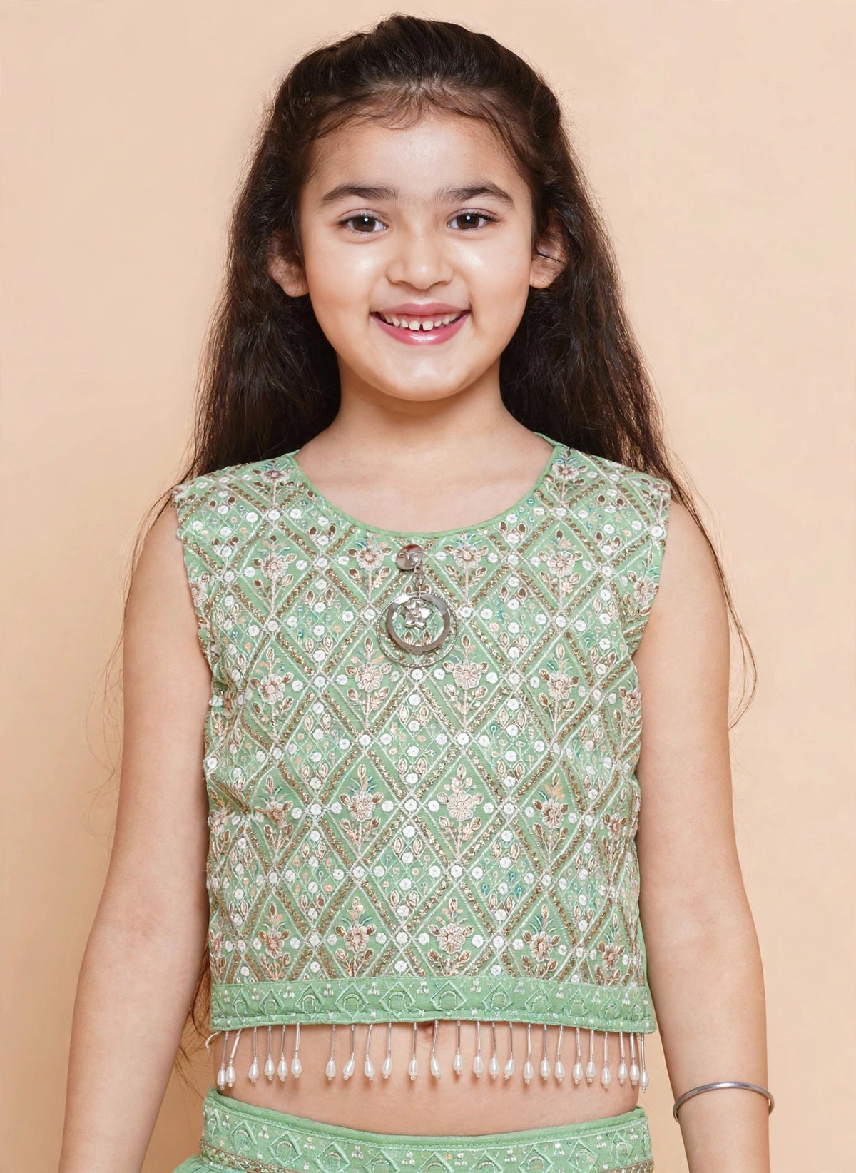 Girls pista green four-piece lehenga set with jacket and sheer dupatta