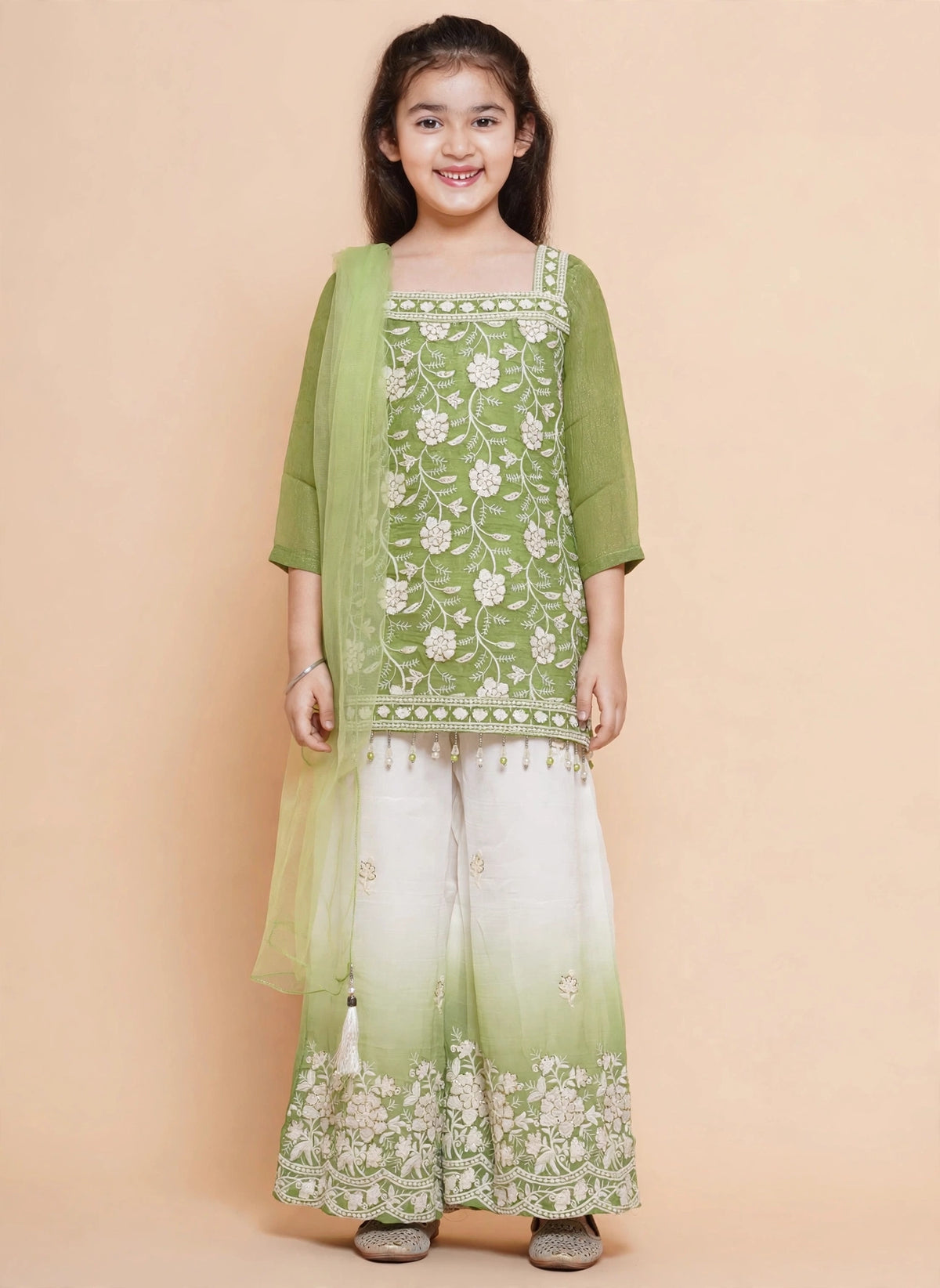 Side view of girls green kurti palazzo suit with sheer three-quarter sleeves