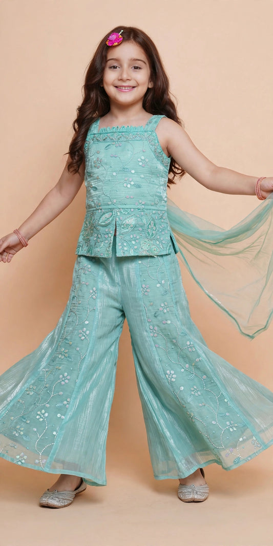 Girls light blue sequin palazzo set in motion showing flowing embroidered pants and sheer dupatta