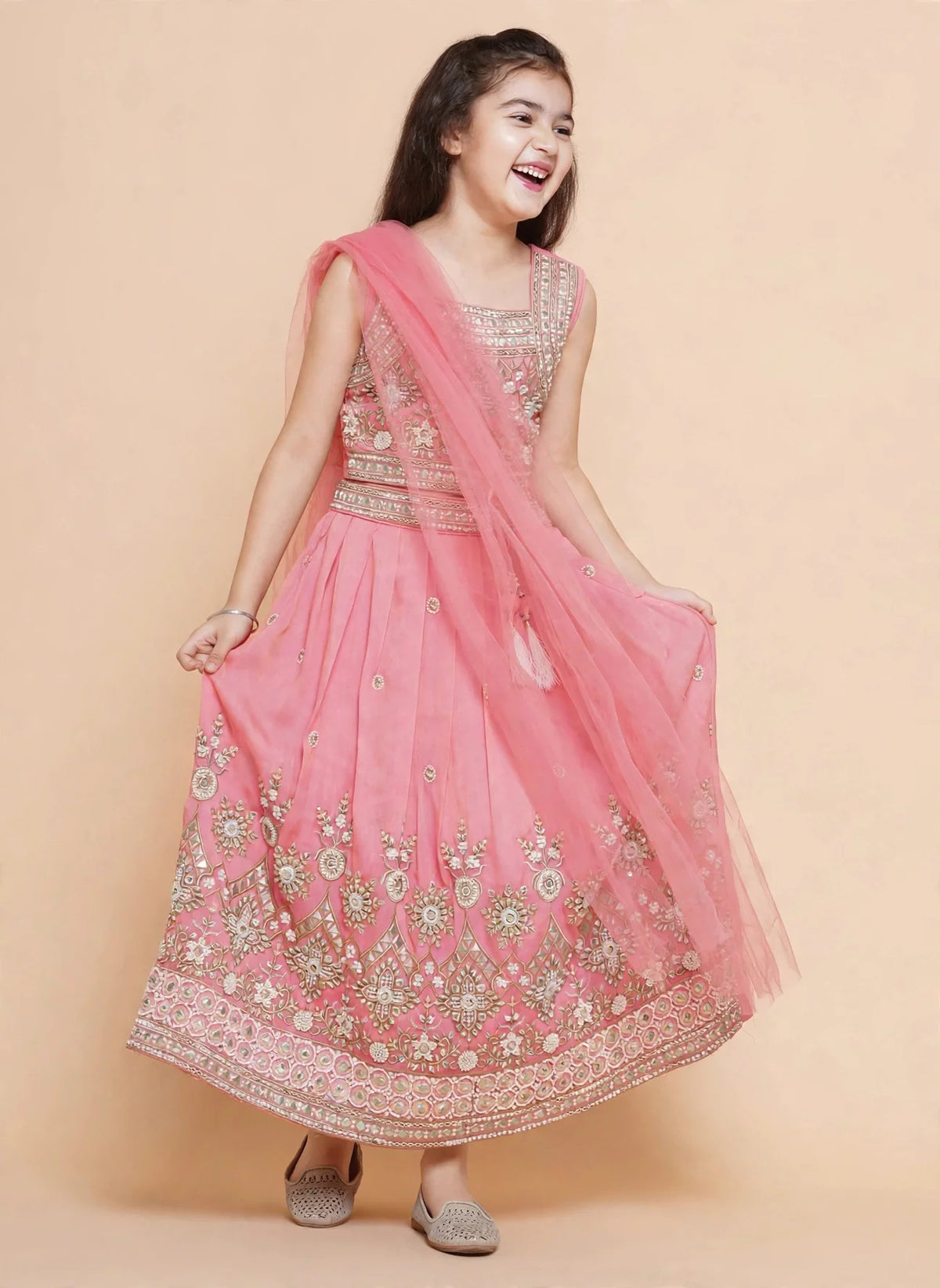 Pink lehenga skirt with scattered gold motifs and pink pom-pom latkan