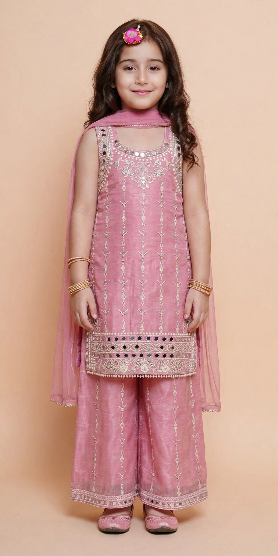 Front view of girls pink mirror work kurta with embroidered palazzo pants and matching dupatta