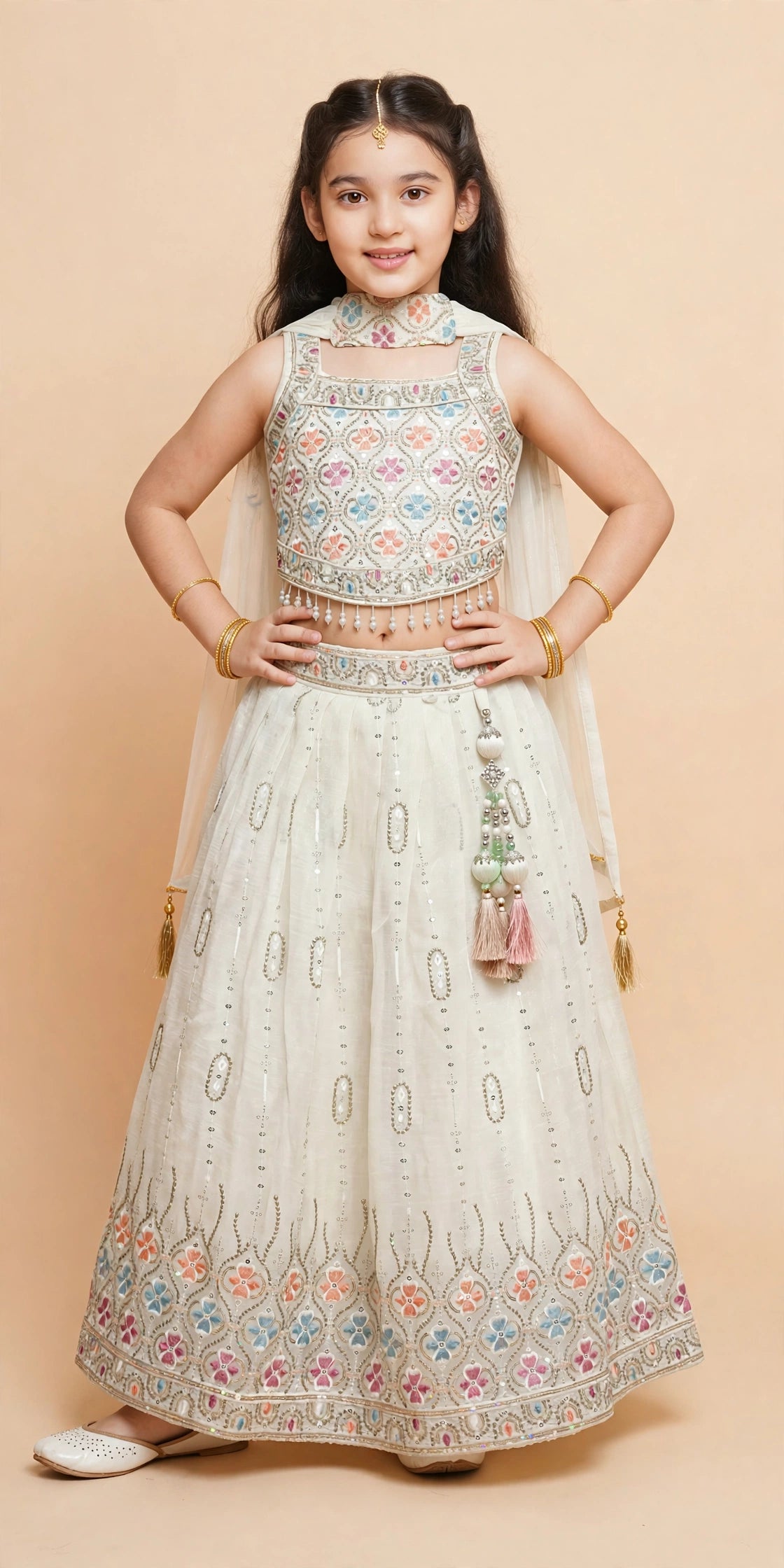 Girls ivory floral sequin lehenga twirling with dupatta styled at the neck
