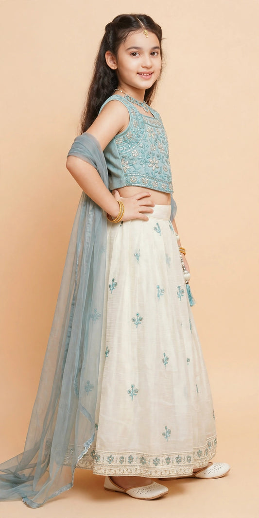 Close-up of built-in can-can net layer and pearl-bead latkan on ivory lehenga