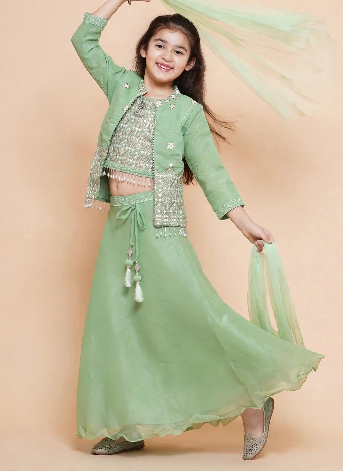 Girls twirling in pista green lehenga choli without the jacket