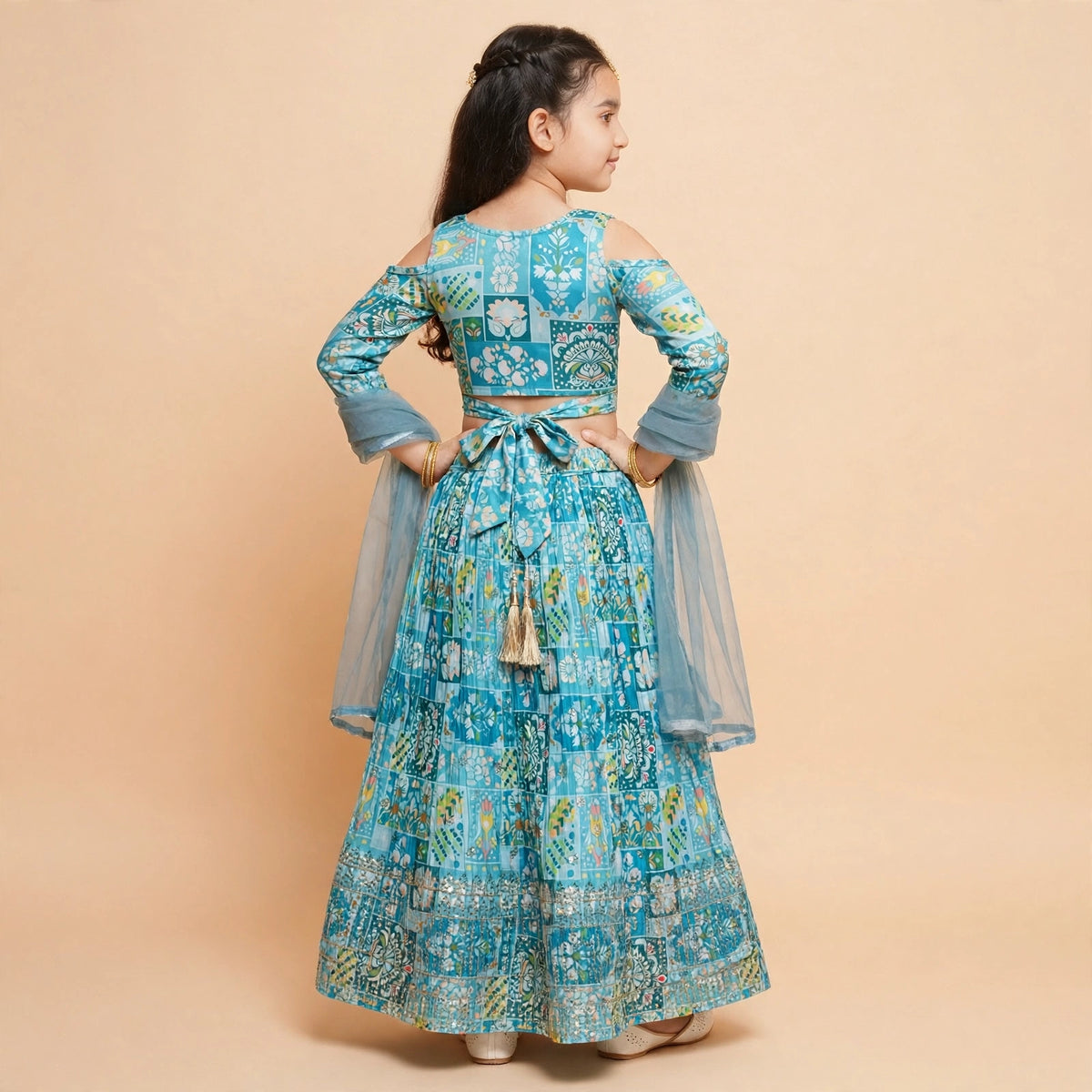 Girls sky blue patchwork lehenga styled with the included long-sleeve inner top