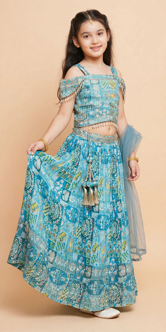Sky blue printed lehenga choli showing pearl fringe and decorative waist latkan