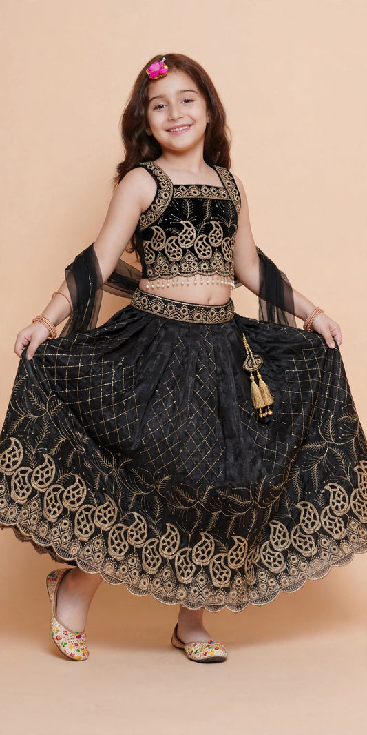 Girls sleeveless black and gold choli with full-flared embroidered lehenga skirt