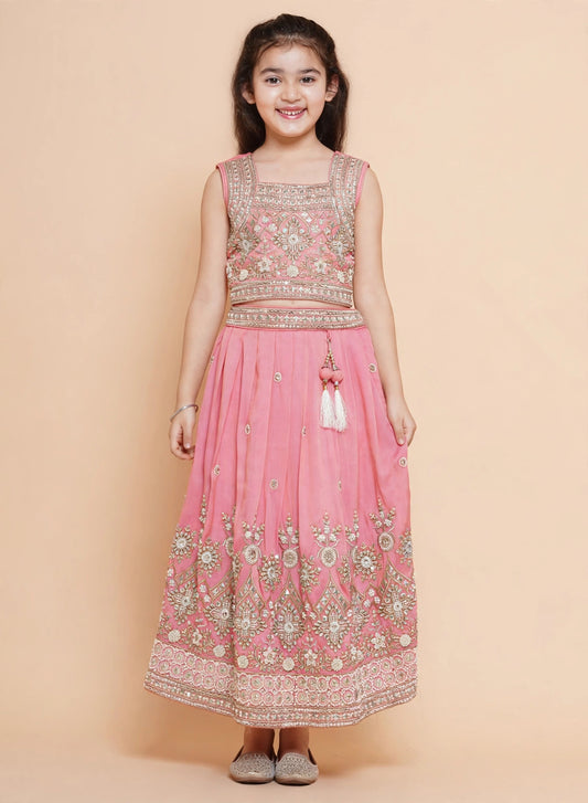 Front view of girls pink lehenga choli with gold zari and sequin embroidery
