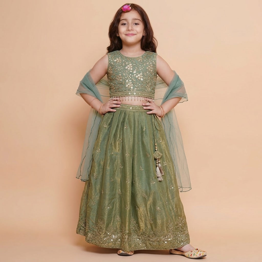 Front view of girls sleeveless sage green lehenga choli with gold embroidery and sheer dupatta