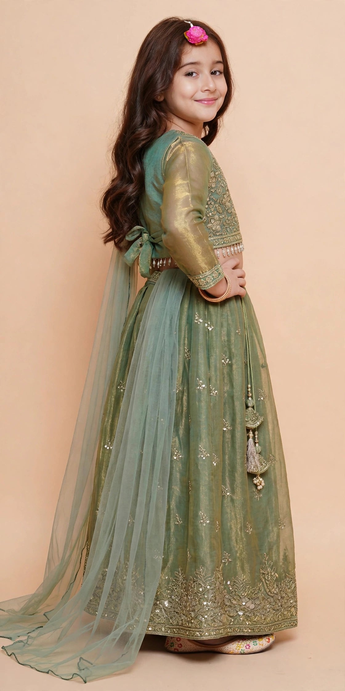 Girls full-sleeve sage green lehenga choli with dupatta draped over shoulder