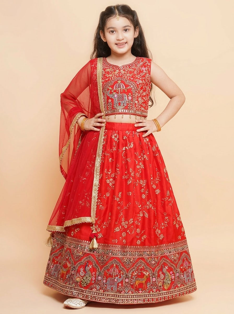 Girls red lehenga set with elephant motif choli and ornate skirt border