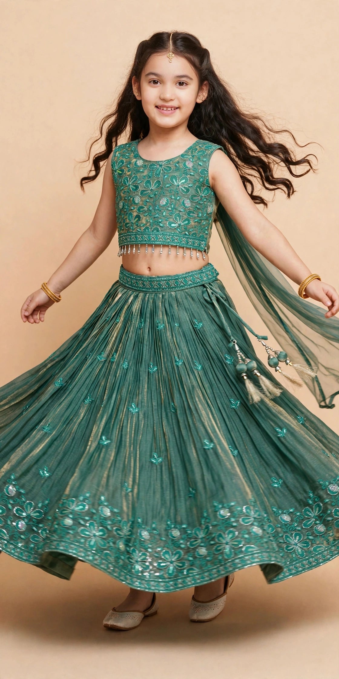 Girls deep green floral embroidered lehenga choli in motion showing the full skirt flare